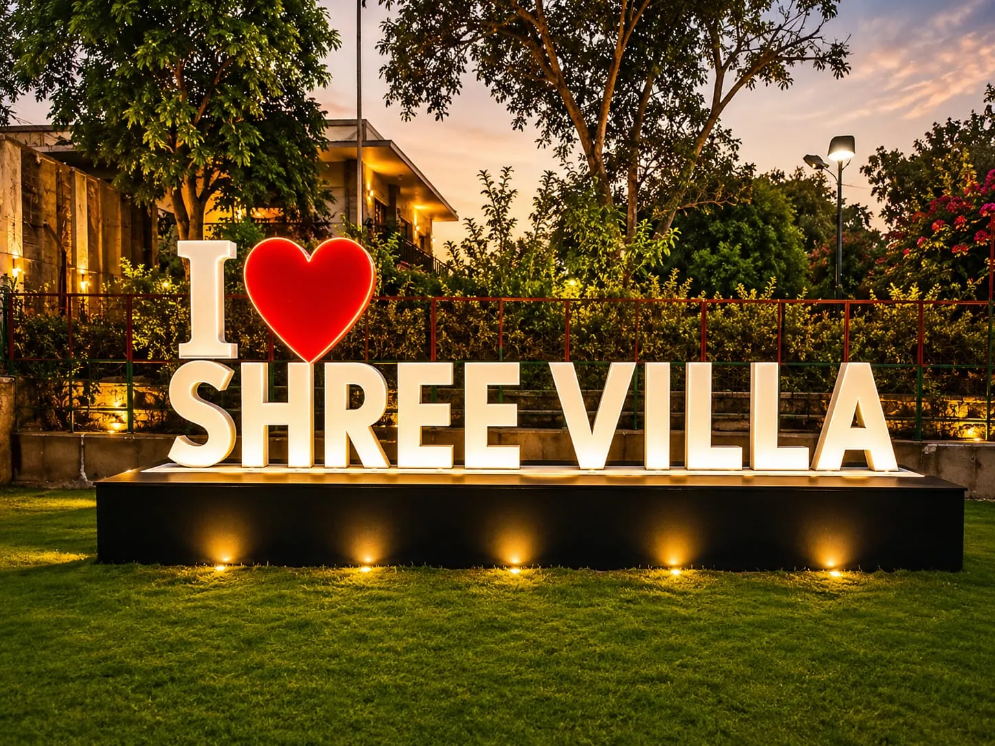 I love Shree Villa sign on the lawn at sunset
